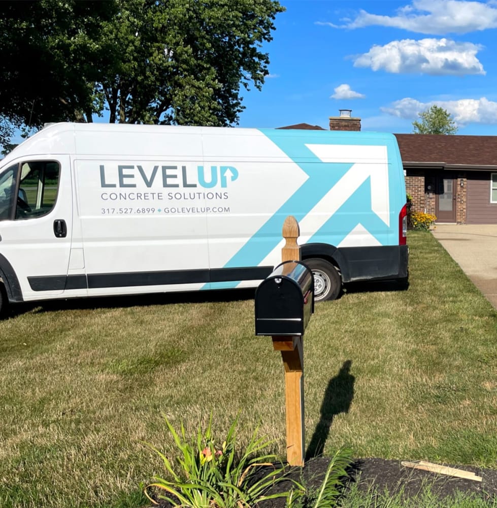 A LevelUp truck parked in front of a residential home