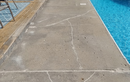 Cracked pool deck after repair and joints sealed with NexusPro