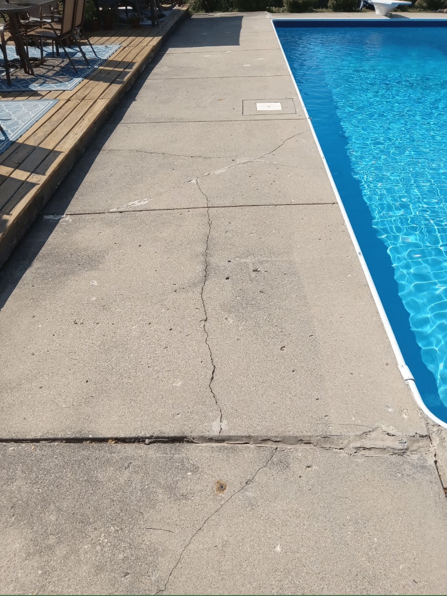 Cracked pool deck before repair