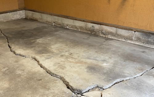 Cracked garage floor before repair
