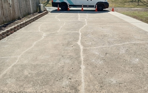 Repaired concrete driveway crack