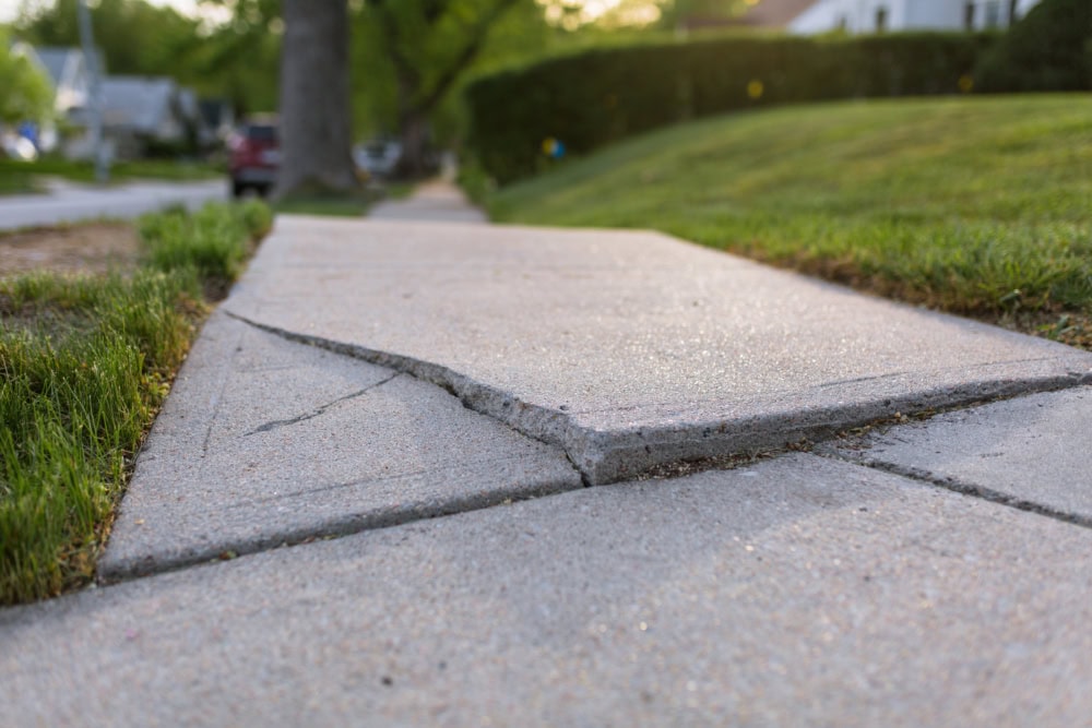 sidewalk concrete crack and sinking